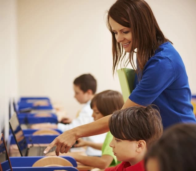 Teacher helping student